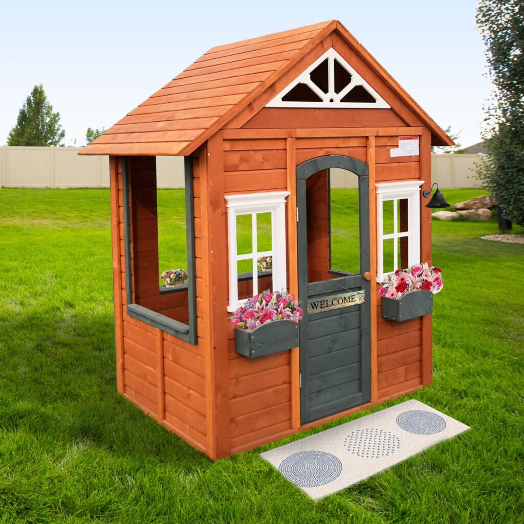 This is our wooden outdoor playhouse. The door and window boxes is why I chose this affordable wooden playhouse. 