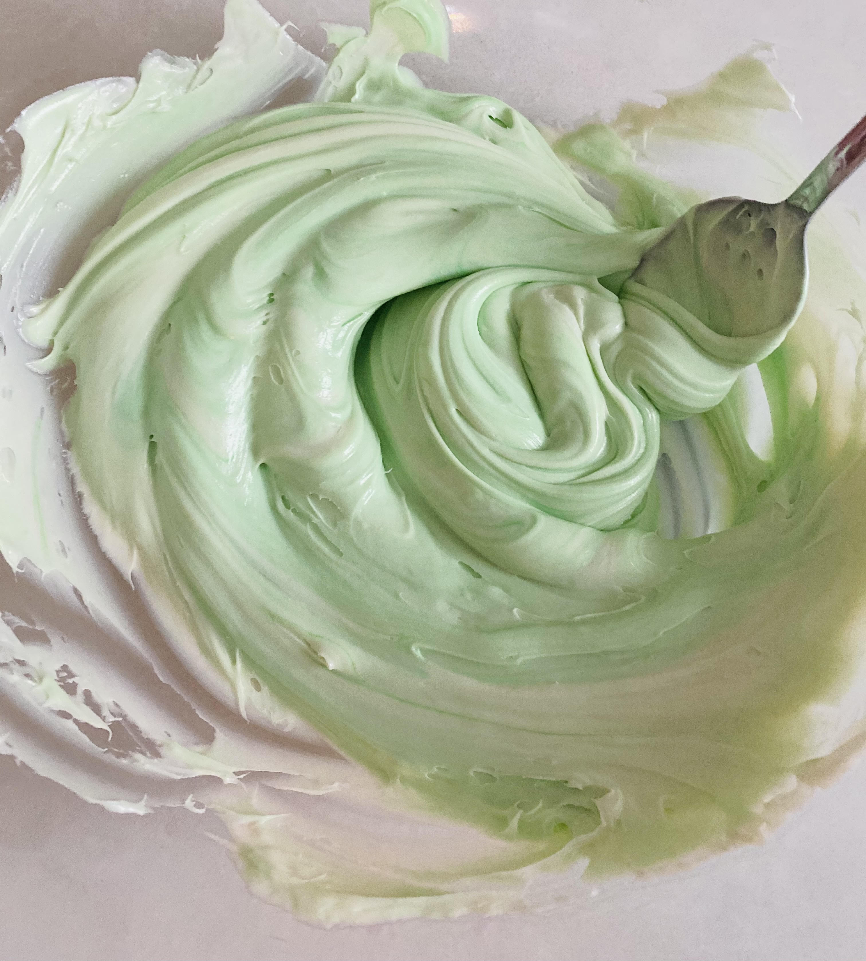 mix the food coloring into vanilla frosting for desired color for the edible playdoh. We are making "ice cream" edible playdoh so this is "mint chocolate chip" 
