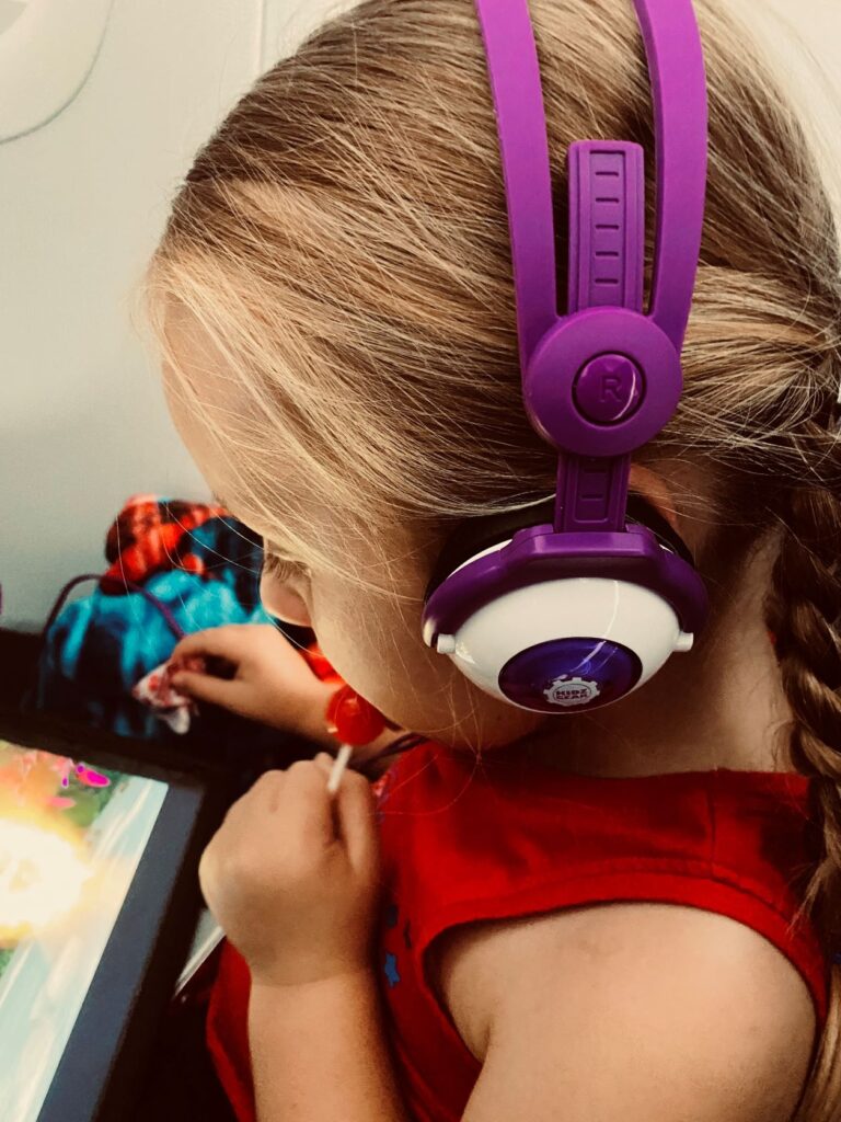 When traveling with toddlers or children, do not assume everyone on the plane wants to hear their iPad or what they are watching. Make sure they keep kid-sized headphones on!