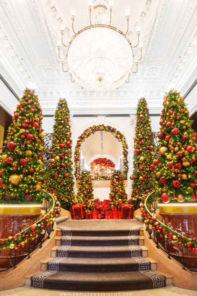 Peninsula Hotel New York Christmas lobby with towering decorated tree and sparkling lights