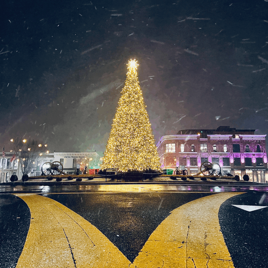 Low Angle View from the Street of Beautiful Lights on a Tall Christmas Tree at Franklin Public Square in Downtown Franklin, Tennessee near Nashville at Night
